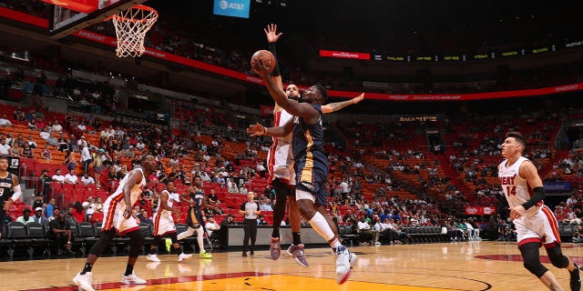 Zion Williamson, #1 of the New Orleans Pelicans, drives to the basket during a preseason game against the Miami Heat on Oct. 12, 2022 at FTX Arena in Miami.