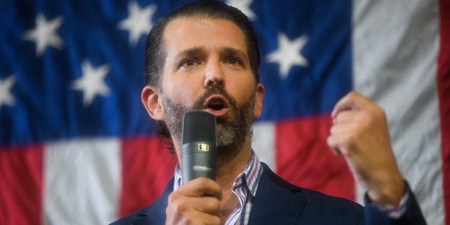 Donald Trump Jr. speaks to audience members during a campaign rally at Illuminating Technologies in Greensboro, North Carolina. 
