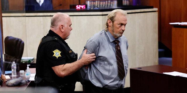 Curtis Edward Smith, 62, is taken back to jail after a judge revoked his bond at a hearing on Thursday, Aug. 11, 2022, in the Richland County Courthouse in Columbia, South Carolina. 