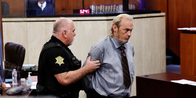 Curtis Edward Smith, 62, is taken back to jail after a judge revoked his bond at a hearing on Thursday, Aug. 11, 2022, in the Richland County Courthouse in Columbia, South Carolina. 