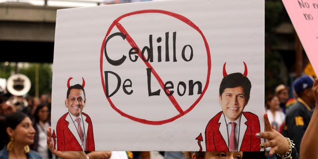 Hundreds of Oaxacan community members march for justice through the streets of downtown Los Angeles toward City Hall on October 15, 2022, calling for the immediate resignation of Los Angeles Council members Jill Cedillo and Kevin de Leon.