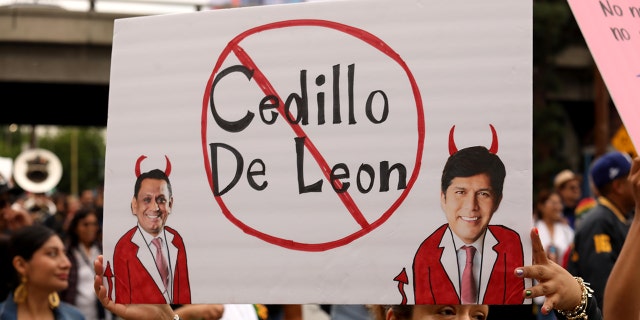 Hundreds of members of the Oaxacan community participate in a March for Justice through the streets of downtown Los Angeles toward City Hall on Oct. 15, 2022, demanding the immediate resignation of Los Angeles council members Gil Cedillo and Kevin de Leon. 