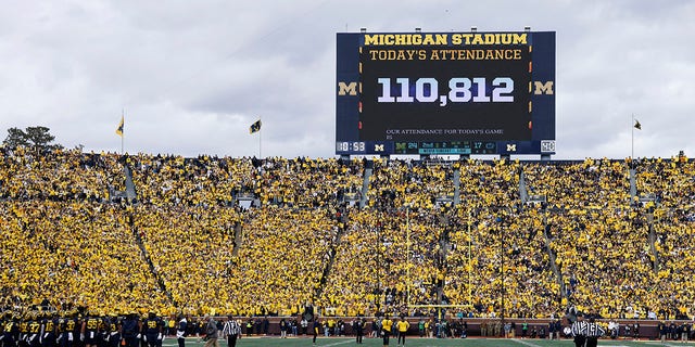 The attendance is displayed on the scoreboard during a college football game between the Michigan Wolverines and the Penn State Nittany Lions on October 15, 2022 at Michigan Stadium in Ann Arbor, Michigan. 