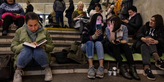 Residents of Kyiv wait in an underground metro station during a two-hour air alarm on Oct. 20, 2022, in Kyiv, Ukraine.