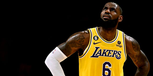 LeBron James, #6 of the Los Angeles Lakers, looks toward the video board against the LA Clippers in the first half of an NBA basketball game at the Crypto.com Arena in Los Angeles on Thursday, Oct. 20, 2022. 