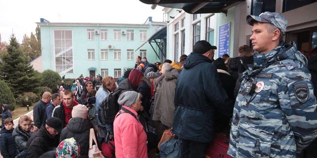 People arrived from Kherson wait for further evacuation into the depths of Russia at the Dzhankoi's railway station in Crimea on Oct. 21, 2022.