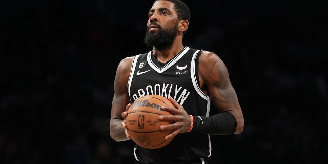 Kyrie Irving of the Brooklyn Nets prepares to shoot a free throw during the game against the Dallas Mavericks on October 27, 2022, at Barclays Center in Brooklyn, New York.