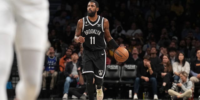 Kyrie Irving #11 of the Brooklyn Nets dribbles the ball during the game against the Dallas Mavericks on October 27, 2022 at Barclays Center in Brooklyn, New York. 