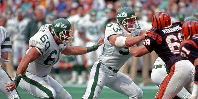 Offensive lineman Jim Sweeney (53) of the New York Jets blocks defensive lineman Tim Krumrie (69) of the Cincinnati Bengals during a game at Riverfront Stadium on Oct. 9, 1988, in Cincinnati.