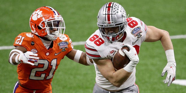 Jeremy Ruckert (88) of Ohio State carries the ball against Malcolm Greene of Clemson in the first half of the Allstate Sugar Bowl on Jan. 1, 2021, in New Orleans.