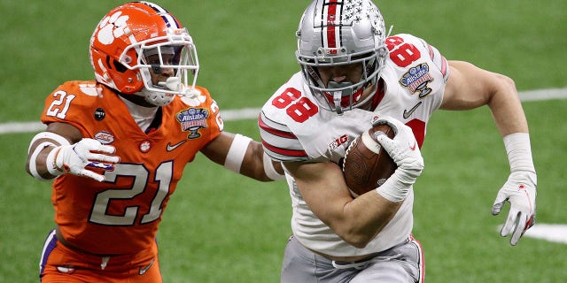 Jeremy Ruckert (88) of Ohio State carries the ball against Malcolm Greene of Clemson in the first half of the Allstate Sugar Bowl on Jan. 1, 2021, in New Orleans.