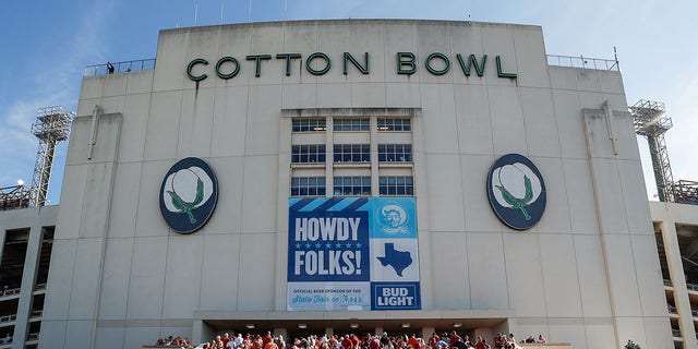 Fans arrive at the Cotton Bowl before the 2021 Red River Showdown between the Texas Longhorns and Oklahoma Sooners Oct. 9, 2021, in Dallas, Texas. 