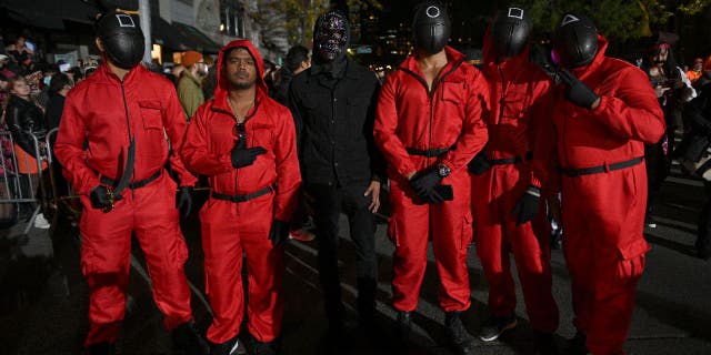 Halloween costumes 'banned' over time as eBay removes Jeffrey Dahmer-inspired outfit 3 by Netflix "squid game" is still one of the most sought-after costumes for 2022, according to the Halloween and Costume Association. Pictured are a group of people wearing pink and black jumpsuits from "squid game" during the 48th Annual New York Village Halloween Parade on October 31, 2021.