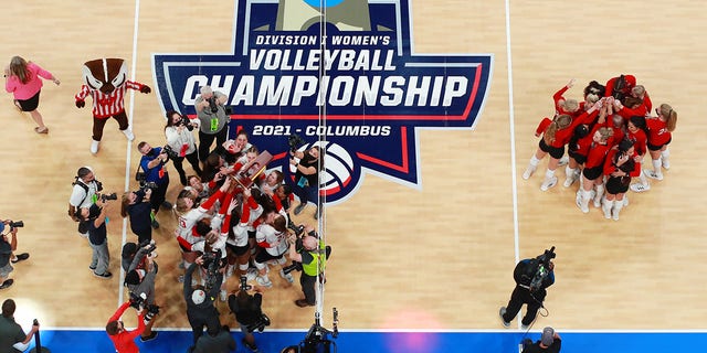 The Wisconsin Badgers celebrate after defeating the Nebraska Cornhuskers during the Division I Women's Volleyball Championship on December 18, 2021 in Columbus, Ohio.  (Photo of 