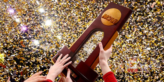 The Wisconsin Badgers celebrate after defeating the Nebraska Cornhuskers during the Division I Women's Volleyball Championship on December 18, 2021 in Columbus, Ohio. 