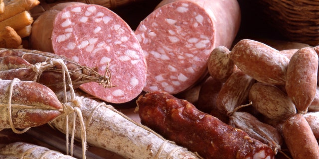 A variety of delicatessen products of Italy are shown in this image. 