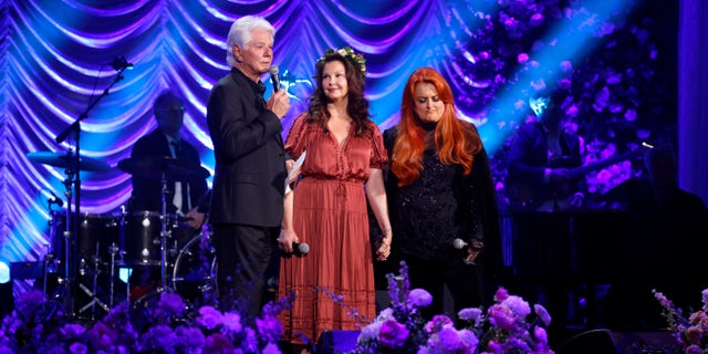 Larry Strickland, Naomi's husband, appeared on stage with Naomi's daughters Ashley and Wynonna during CMT and Sandbox Live's "Naomi Judd: A River Of Time Celebration" at the Ryman Auditorium in May.