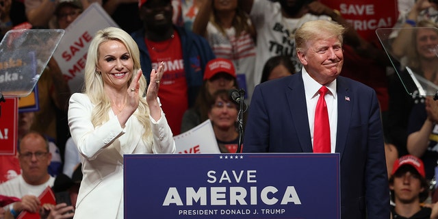 Republican US Senate candidate Kelly Tshibaka stands on stage with former President Trump during the "Save America" demonstration at Alaska Airlines Center on July 9, 2022 in Anchorage, Alaska.