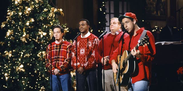 The "Grown Ups" star went on to say that Murray particularly detested Adam Sandler, right, and the late Chris Farley, next to Sandler. Rob Schneider, left, Tim Meadows, next to Schneider, Farley, and Sandler are pictured on "SNL" in 1993.