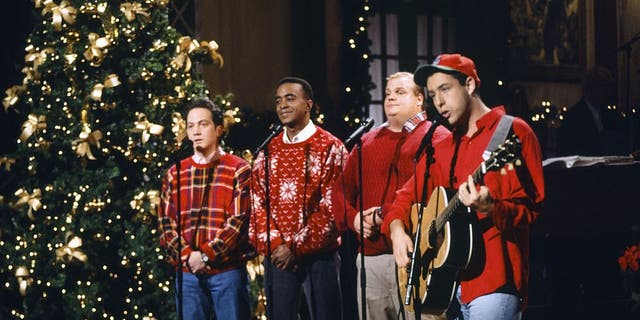 The "Grown Ups" star went on to say that Murray particularly detested Adam Sandler, right, and the late Chris Farley, next to Sandler. Rob Schneider, left, Tim Meadows, next to Schneider, Farley, and Sandler are pictured on "SNL" in 1993.