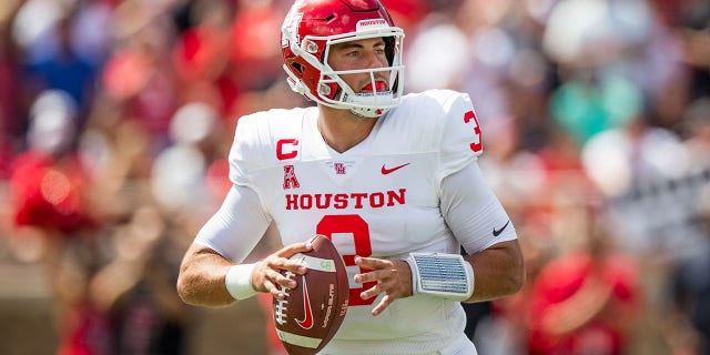 Quarterback Clayton Tune #3 of the Houston Cougars looks to pass during the first half of the game against the Texas Tech Red Raiders at Jones AT&amp;amp;T Stadium on September 10, 2022, in Lubbock, Texas. 