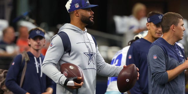 Dak Prescott of the Dallas Cowboys looks on during warmups before the Cincinnati Bengals game on Sept. 18, 2022, in Arlington, Texas.