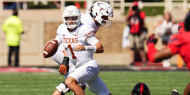 Hudson Card (1) of the Texas Longhorns looks to pass during the first half against the Texas Tech Red Raiders Sept. 24, 2022, in Lubbock, Texas. 