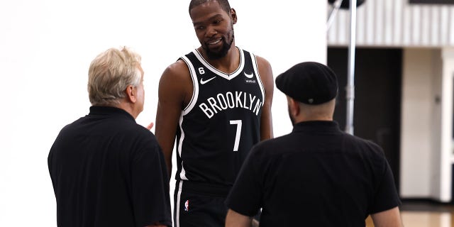 Kevin Durant, #7 of the Brooklyn Nets, speaks to photographers during Brooklyn Nets Media Day at HSS Training Center on September 26, 2022, in Brooklyn, New York. 