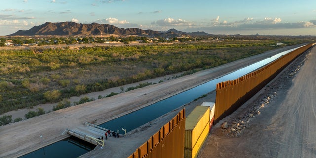 Some gaps in the border fence built by the Trump administration were recently filled with shipping containers by the Arizona state government, making it more difficult for immigrants to cross in certain areas. 
