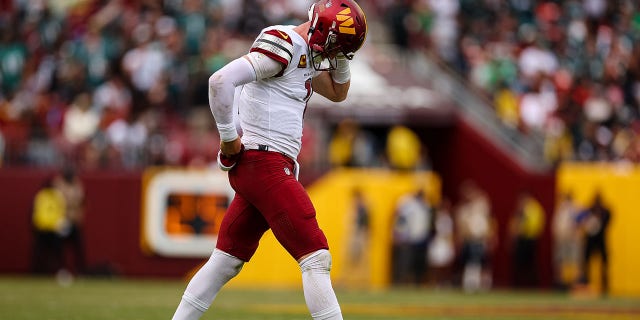 Carson Wentz of the Washington Commanders reacts after a play against the Philadelphia Eagles during the second half at FedEx Field Sept. 25, 2022, in Landover, Md. 