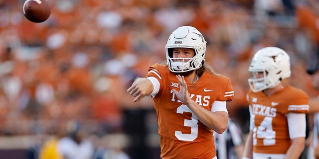 Quinn Ewers of the Texas Longhorns throws a pass before a game against the West Virginia Mountaineers at Darrell K Royal-Texas Memorial Stadium Oct. 1, 2022 in Austin, Texas. 