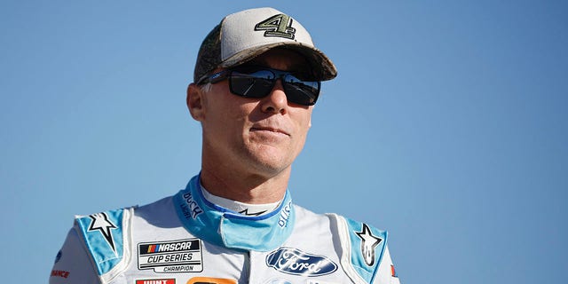 Kevin Harvick, driver of the #4 Busch Light Ford, walks the grid during qualifying for the NASCAR Cup Series YellaWood 500 at Talladega Superspeedway on Oct. 1, 2022 in Talladega, Alabama.