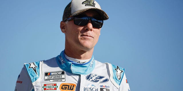 Kevin Harvick, driver of the #4 Busch Light Ford, walks the grid during qualifying for the NASCAR Cup Series YellaWood 500 at Talladega Superspeedway on Oct. 1, 2022 in Talladega, Alabama.