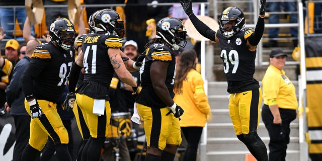 Minkah Fitzpatrick, right, of the Pittsburgh Steelers celebrates with teammates after making an interception in the third quarter against the New York Jets at Acrisure Stadium in Pittsburgh, Pennsylvania, on Sunday.