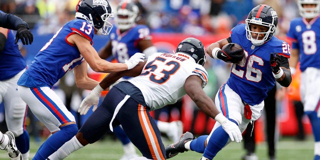Saquon Barkley (26) of the New York Giants carries the ball against the Chicago Bears at MetLife Stadium on Oct. 2, 2022, in East Rutherford, New Jersey.