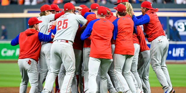 The Philadelphia Phillies celebrate after clinching the Wild Card, their first playoff berth since 2011 with a 3-0 win over the Houston Astros at Minute Maid Park on Oct. 3, 2022 in Houston.