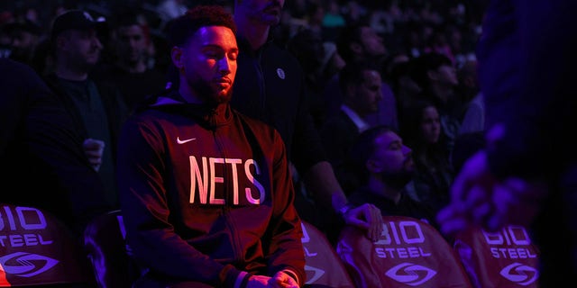 Ben Simmons of the Brooklyn Nets pauses on the bench during player introductions before a preseason game against the Philadelphia 76ers at Barclays Center Oct. 3, 2022, in the Brooklyn borough of New York City. 