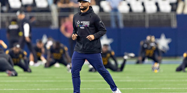 Dak Prescott, #4 of the Dallas Cowboys, on the field before a game against the Washington Commanders at AT&T Stadium on Oct. 2, 2022 in Arlington, Texas. The Cowboys defeated the Commanders 25-10.
