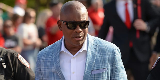 Interim head coach Mickey Joseph of the Nebraska Cornhuskers walks to the stadium with the team before the game against the Indiana Hoosiers at Memorial Stadium on Oct. 1, 2022 in Lincoln, Nebraska. 