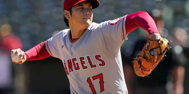 Shohei Ohtani, #17 of the Los Angeles Angels, pitches against the Oakland Athletics in the bottom of the first inning at RingCentral Coliseum on October 5, 2022 in Oakland, California.