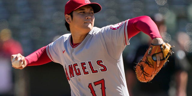 Shohei Ohtani, #17 of the Los Angeles Angels, pitches against the Oakland Athletics in the bottom of the first inning at RingCentral Coliseum on October 5, 2022 in Oakland, California.