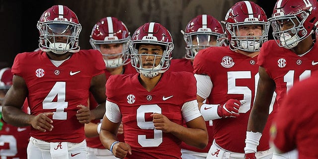 Bryce Young (9) of the Alabama Crimson Tide leads the team onto the field during pregame warmups before facing the Texas A and M Aggies at Bryant-Denny Stadium Oct. 8, 2022, in Tuscaloosa, Ala. 