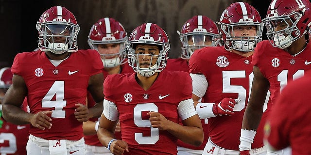 Bryce Young #9 of the Alabama Crimson Tide leads the team onto the field during pregame warmups prior to facing the Texas A&amp;amp;M Aggies at Bryant-Denny Stadium on October 8, 2022, in Tuscaloosa, Alabama. 