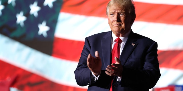 Trump greets supporters during a campaign rally at Minden-Tahoe Airport on October 08, 2022, in Minden, Nevada.