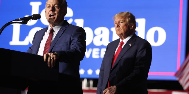 The Republican nominee for Nevada governor, Joe Lombardo, joins former President Donald Trump for a campaign rally on Oct. 8, 2022, in Minden, Nevada.