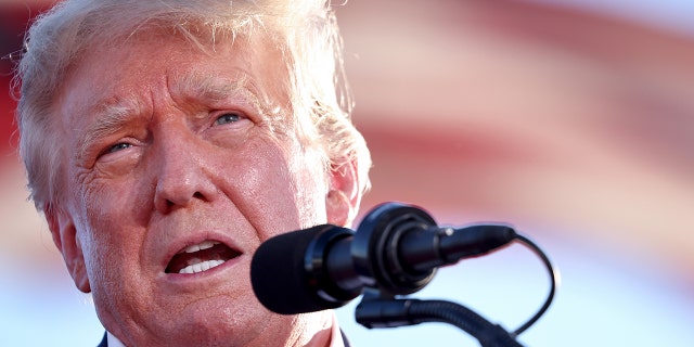 MESA, ARIZONA - OCTOBER 09:  Former U.S. President Donald Trump speaks at a campaign rally at Legacy Sports USA on October 09, 2022 in Mesa, Arizona. 