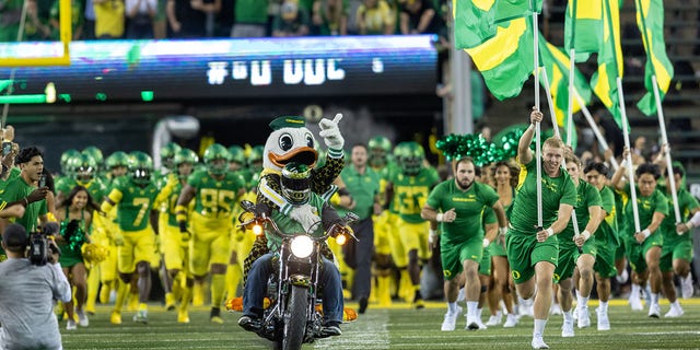 The Oregon Ducks run on the field before their game against the Stanford Cardinal at Autzen Stadium on Oct. 1, 2022 in Eugene, Oregon. 