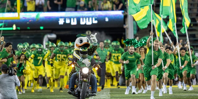 The Oregon Ducks run on the field before their game against the Stanford Cardinal at Autzen Stadium on Oct. 1, 2022 in Eugene, Oregon.