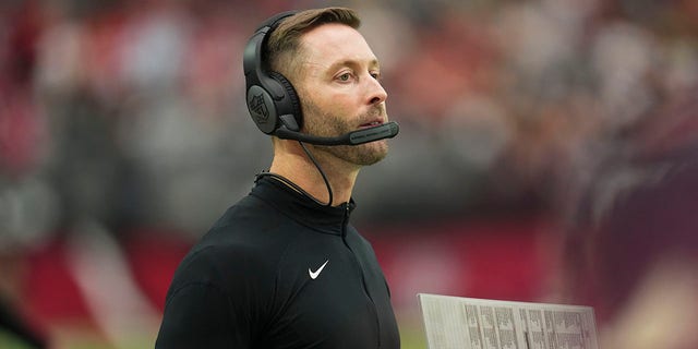 Cardinals head coach Kliff Kingsbury looks out over the field during the Philadelphia Eagles game at State Farm Stadium on October 9, 2022 in Glendale, Arizona.