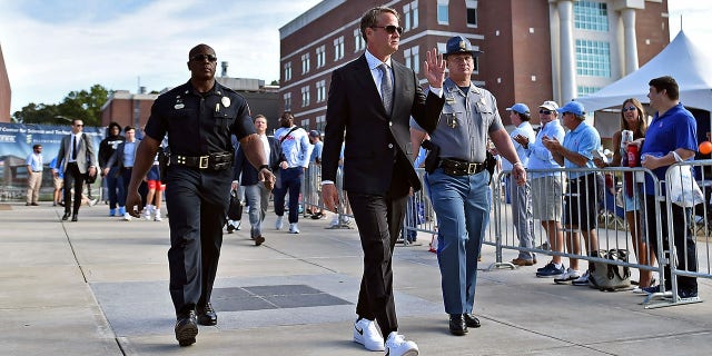 Head coach Lane Kiffin of the Mississippi Rebels arrives before the game against the Auburn Tigers at Vaught-Hemingway Stadium on October 15, 2022, in Oxford, Mississippi.